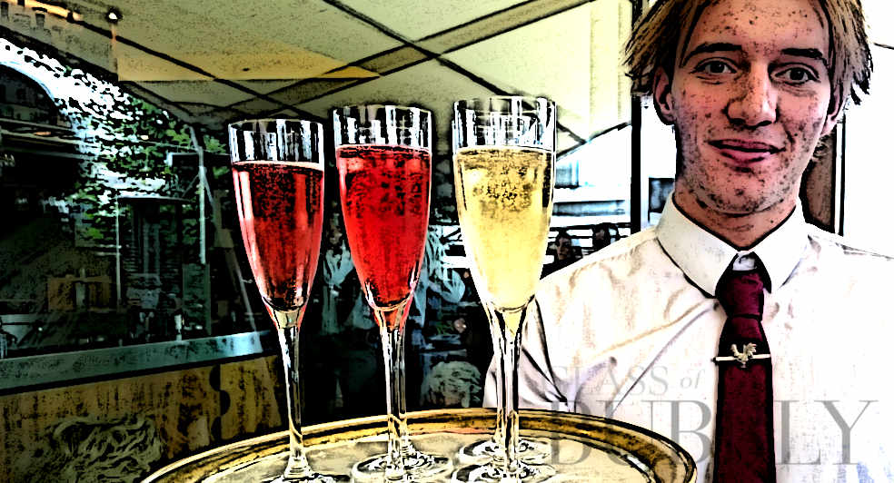 glass of bubbly rose white sommelier sparkling wine