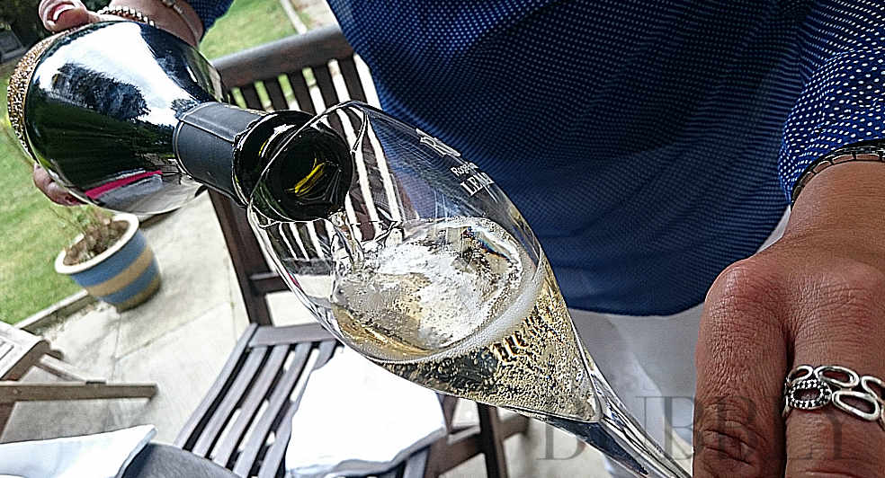 pouring a glass of bubbly champagne RCL