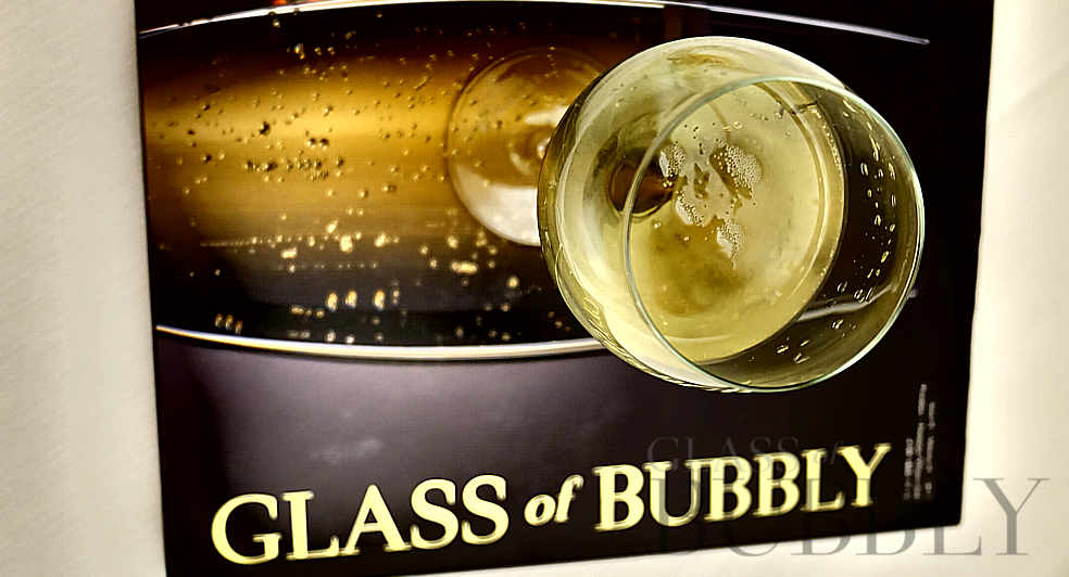 glass of bubbly sign book bubbles