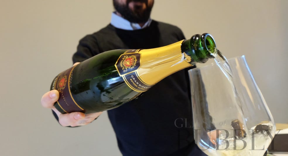 Pouring Le Marche sparkling wine.