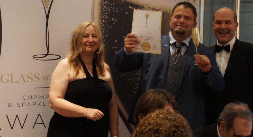Michael collection his Trophy at the 2019 Glass of Bubbly Awards London