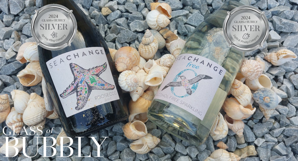 Sea Change Prosecco On Sand Grey Stones With Sea Shells